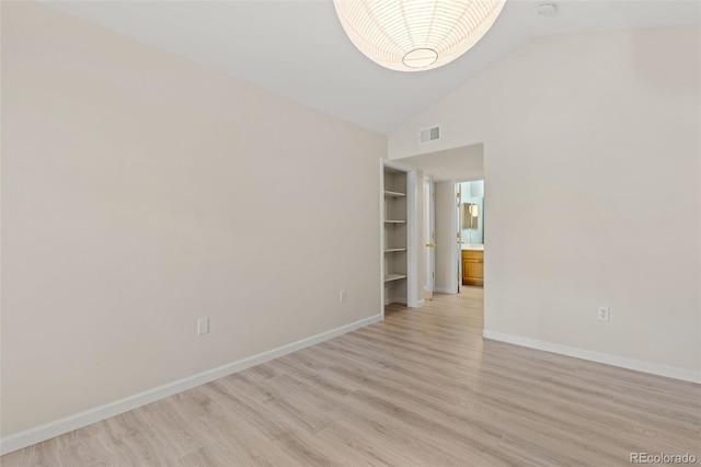 1158 Opal St Unit 203, Broomfield, CO 80020 - spare room featuring light wood-type flooring and high vaulted ceiling