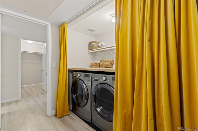 1158 Opal St Unit 203, Broomfield, CO 80020 - laundry room with washing machine and dryer and light wood-style floors