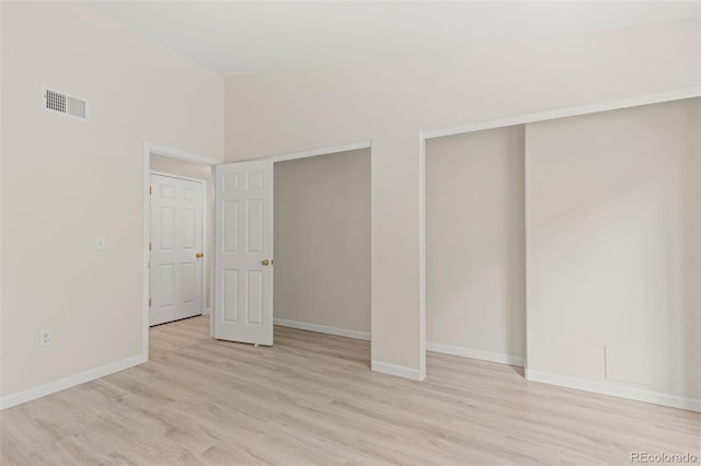 1158 Opal St Unit 203, Broomfield, CO 80020 - unfurnished bedroom featuring light wood-style floors and multiple closets