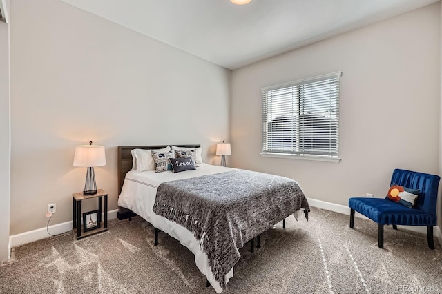 bedroom with carpet floors and baseboards