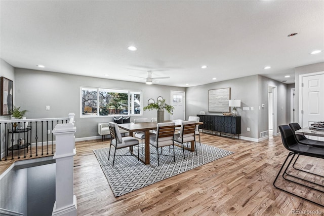 dining room with baseboards, recessed lighting, and light wood-style floors