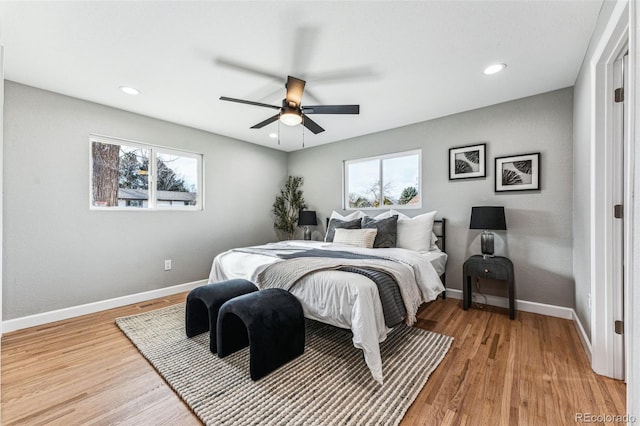 bedroom featuring light wood-type flooring, ceiling fan, baseboards, and recessed lighting