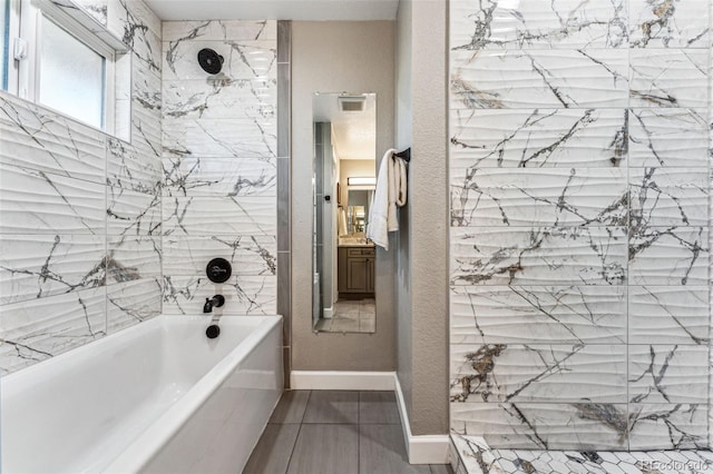 bathroom with visible vents, a shower, a bath, and baseboards