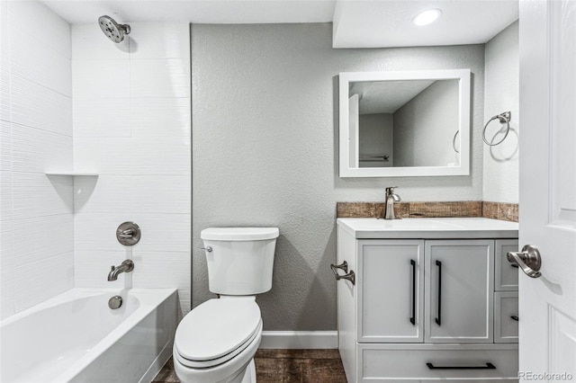 full bathroom with shower / bathtub combination, a textured wall, toilet, vanity, and wood finished floors