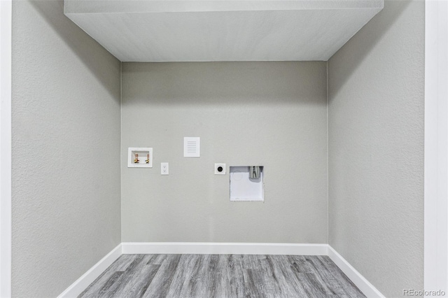 laundry room with washer hookup, hookup for an electric dryer, wood finished floors, laundry area, and baseboards