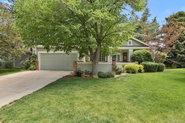 view of property hidden behind natural elements with driveway, an attached garage, a front lawn, and brick siding