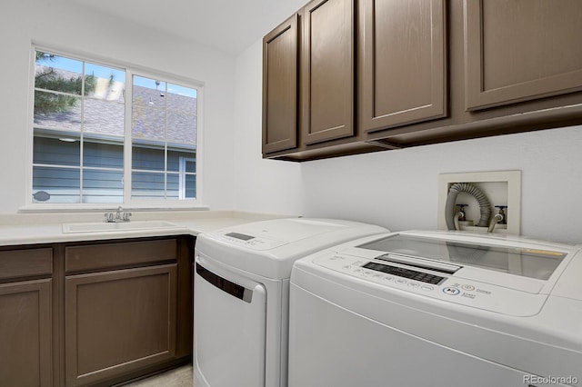 laundry room featuring cabinet space and washer and clothes dryer