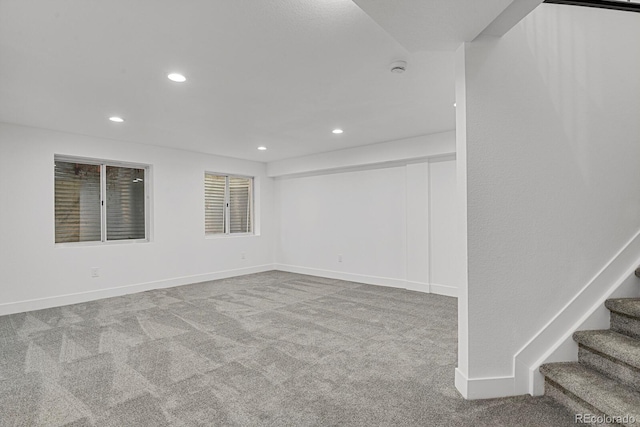 carpeted empty room with recessed lighting, stairs, and baseboards