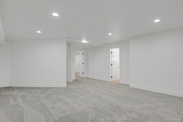 empty room with recessed lighting, baseboards, and carpet