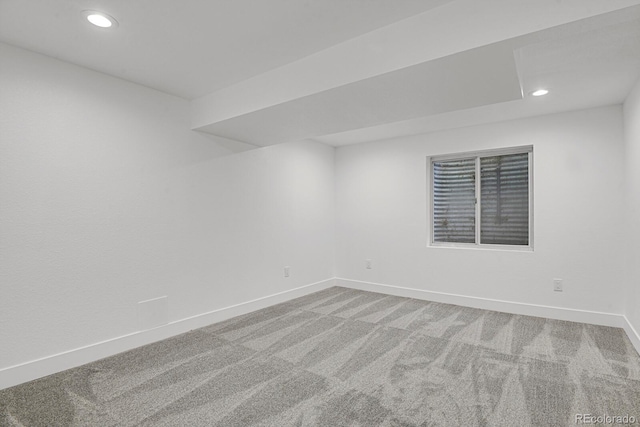 carpeted empty room with baseboards and recessed lighting