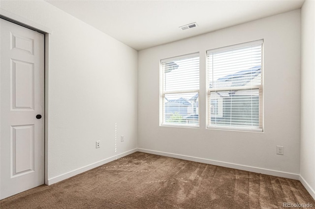 view of carpeted spare room