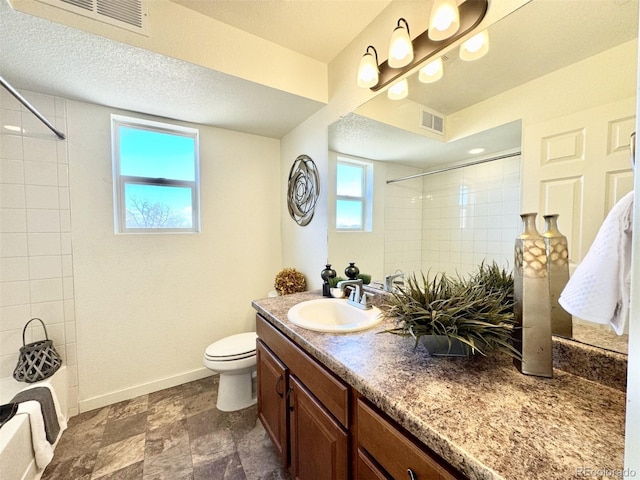 bathroom featuring toilet, baseboards, visible vents, and vanity