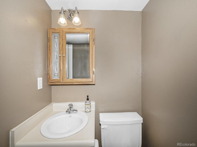 bathroom with sink and toilet