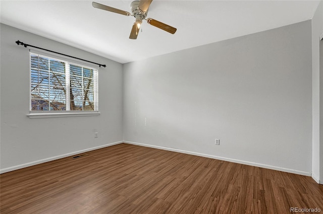 empty room with ceiling fan and wood-type flooring