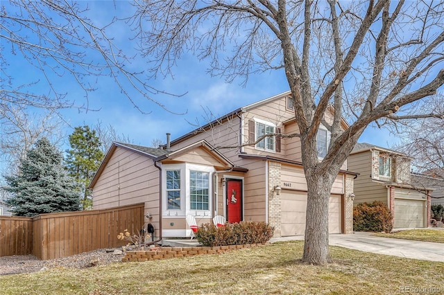 view of front facade with a garage and a front lawn