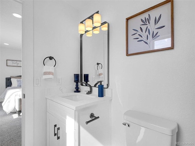 1517 S Elkhart St, Aurora, CO 80012 - ensuite bathroom with vanity, toilet, and recessed lighting