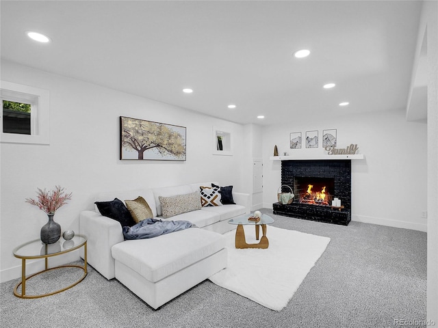 1517 S Elkhart St, Aurora, CO 80012 - living area with a brick fireplace, recessed lighting, carpet flooring, and baseboards