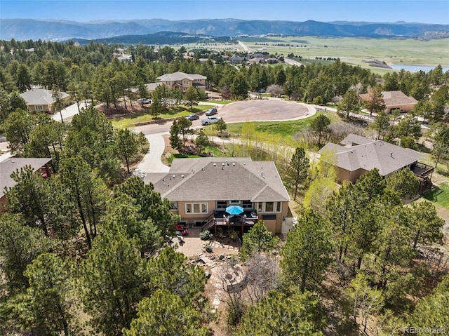 aerial view of property's location featuring a mountain backdrop