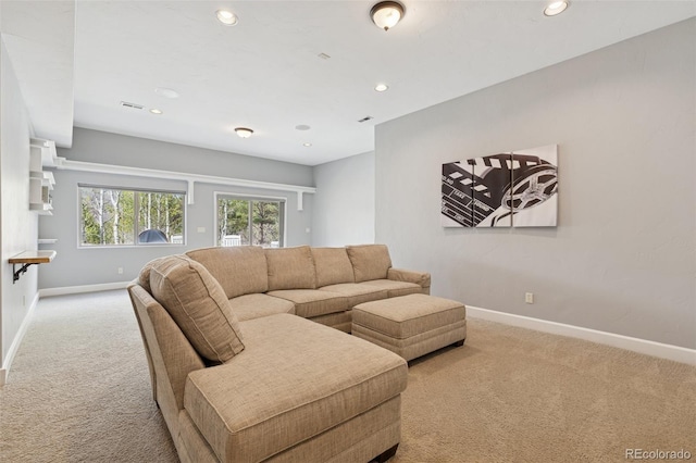 living area with carpet, baseboards, and recessed lighting