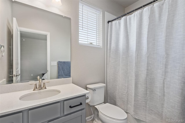 full bath with vanity and toilet