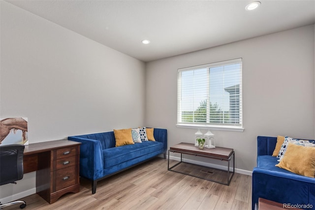 home office featuring light wood-style flooring, baseboards, and recessed lighting