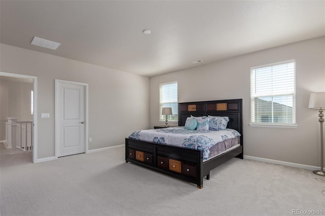 bedroom with carpet and baseboards