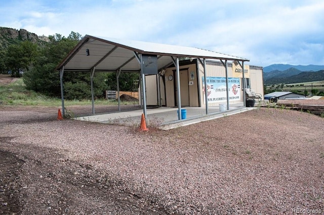 25500 US Highway 50, Cotopaxi, CO 81223 - surrounding community with a mountain view, gravel driveway, and a carport