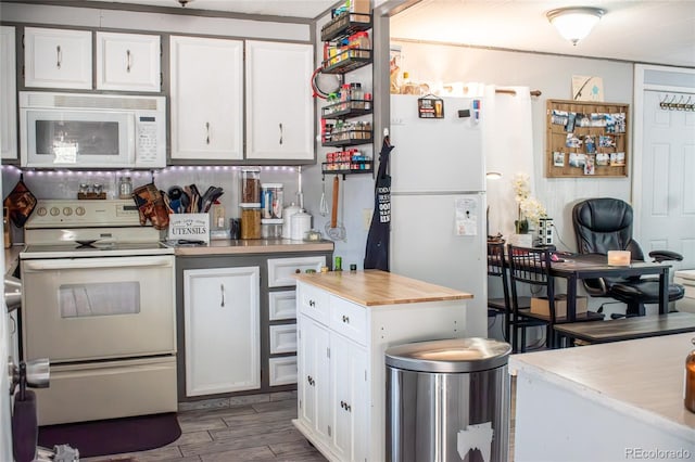 25500 US Highway 50, Cotopaxi, CO 81223 - kitchen with white appliances, white cabinets, and dark wood-style floors
