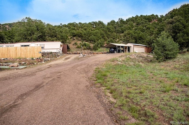 25500 US Highway 50, Cotopaxi, CO 81223 - view of dirt / gravel driveway with a forest view