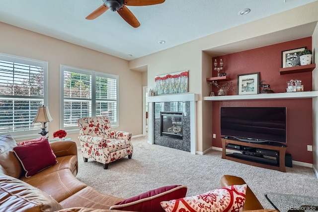 16644 Eolus Way, Broomfield, CO 80023 - living room with a glass covered fireplace, a ceiling fan, and carpet