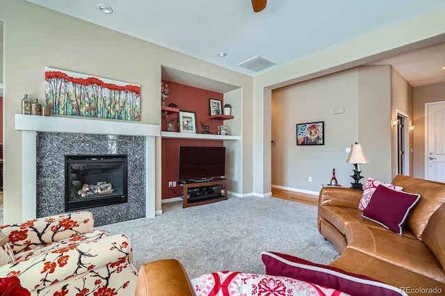 16644 Eolus Way, Broomfield, CO 80023 - living room featuring carpet, a premium fireplace, built in features, and recessed lighting