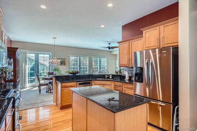 16644 Eolus Way, Broomfield, CO 80023 - kitchen featuring stainless steel appliances, a peninsula, recessed lighting, ceiling fan, and light wood finished floors