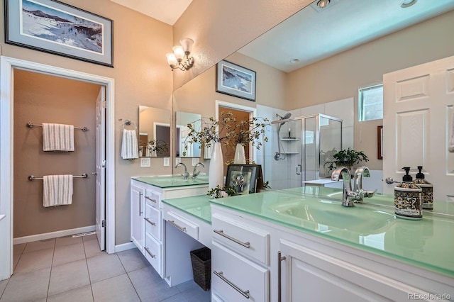 16644 Eolus Way, Broomfield, CO 80023 - bathroom with vanity, tile patterned floors, and a stall shower