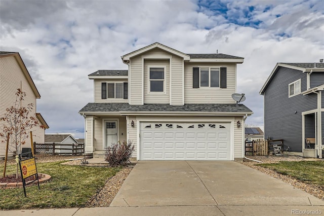 view of front property with a garage and a front lawn