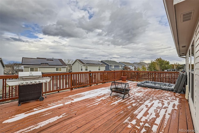 wooden deck featuring area for grilling