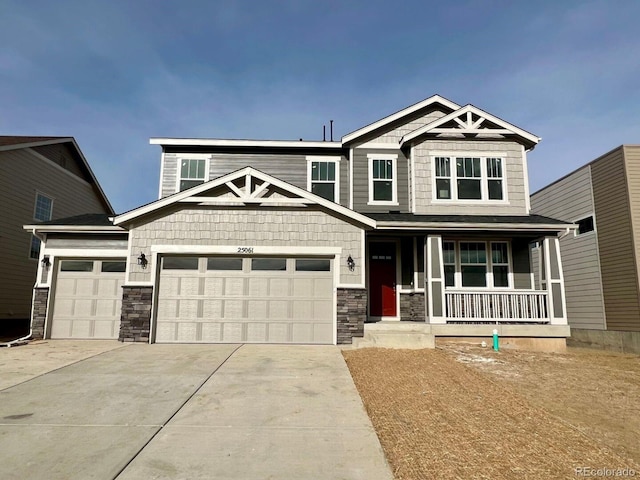 craftsman-style home with covered porch and a garage