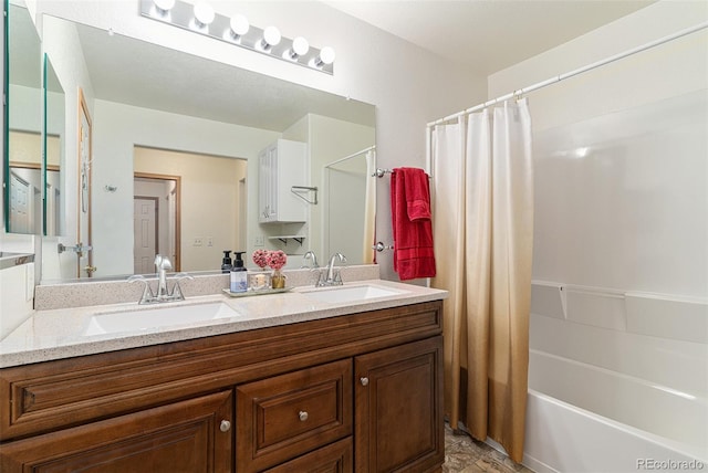 bathroom featuring shower / tub combo and vanity