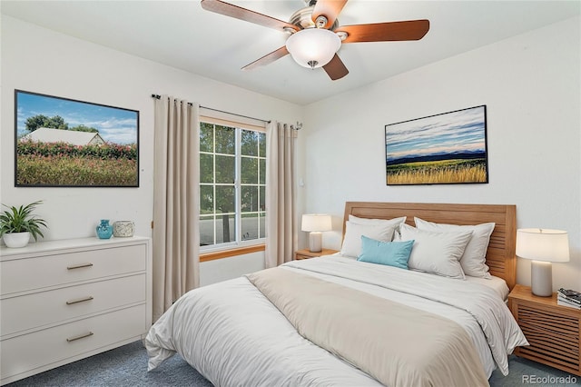 bedroom with ceiling fan and carpet