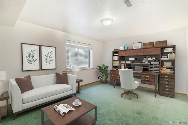 carpeted office with a textured ceiling