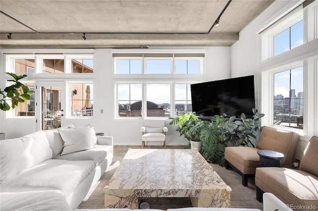 living area featuring wood finished floors and baseboards