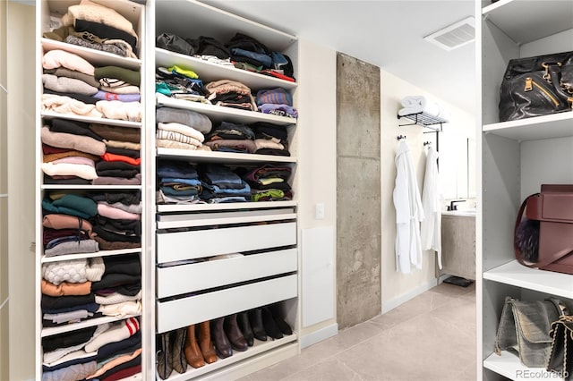 walk in closet featuring tile patterned floors and visible vents