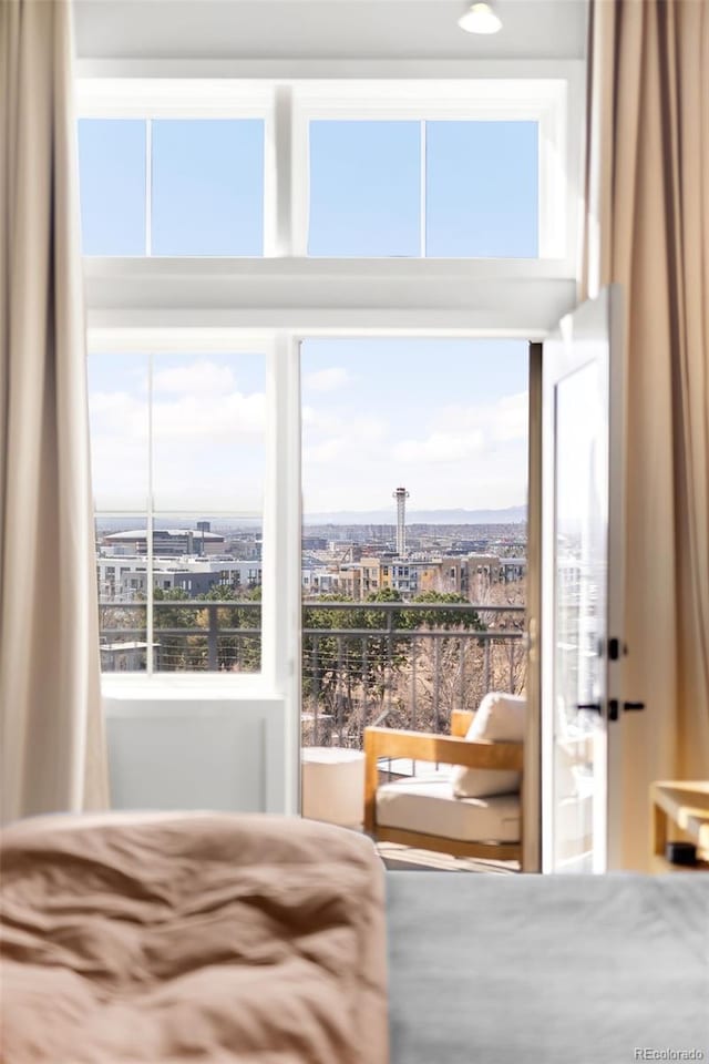 bedroom with a city view