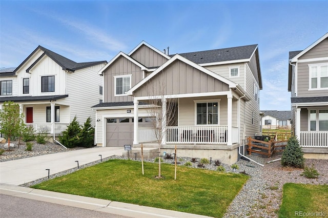 1101 E Witherspoon Dr, Elizabeth, CO 80107 - craftsman-style home with a garage, concrete driveway, board and batten siding, a front lawn, and a porch