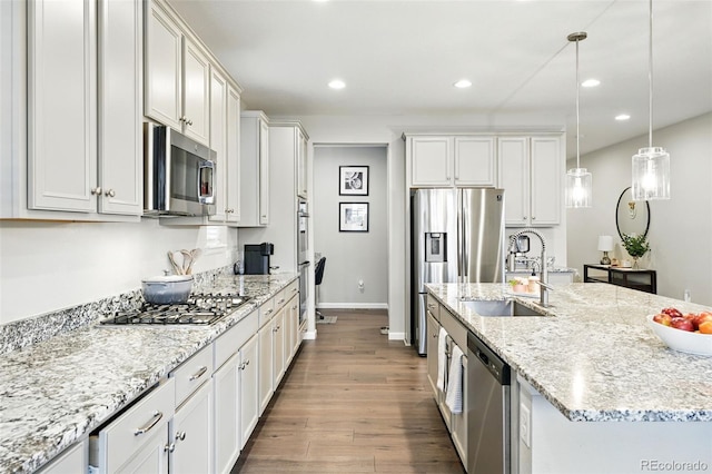 1101 E Witherspoon Dr, Elizabeth, CO 80107 - kitchen featuring a sink, stainless steel appliances, wood finished floors, recessed lighting, and baseboards