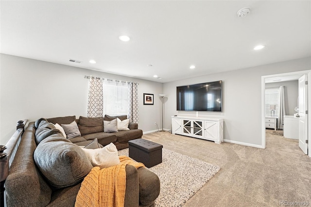 1101 E Witherspoon Dr, Elizabeth, CO 80107 - living area featuring baseboards, recessed lighting, light carpet, and visible vents