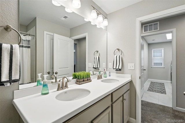 1101 E Witherspoon Dr, Elizabeth, CO 80107 - bathroom with double vanity, visible vents, and a sink