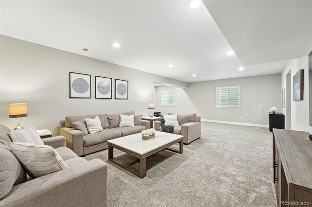 1101 E Witherspoon Dr, Elizabeth, CO 80107 - living room featuring light colored carpet, visible vents, baseboards, and recessed lighting