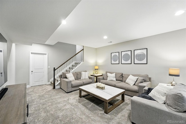 1101 E Witherspoon Dr, Elizabeth, CO 80107 - carpeted living room with stairs, baseboards, and recessed lighting