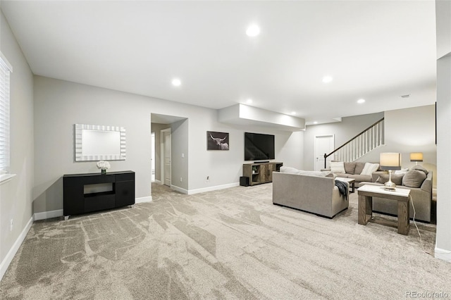 1101 E Witherspoon Dr, Elizabeth, CO 80107 - carpeted living area with baseboards, stairway, and recessed lighting