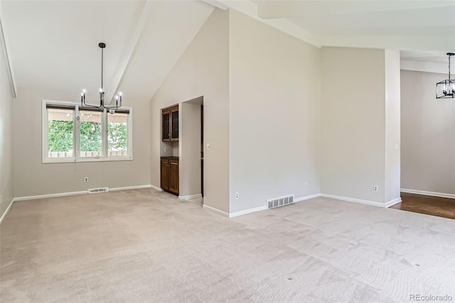 4780 W 102nd Pl, Westminster, CO 80031 - unfurnished room with a chandelier, light colored carpet, high vaulted ceiling, and beamed ceiling